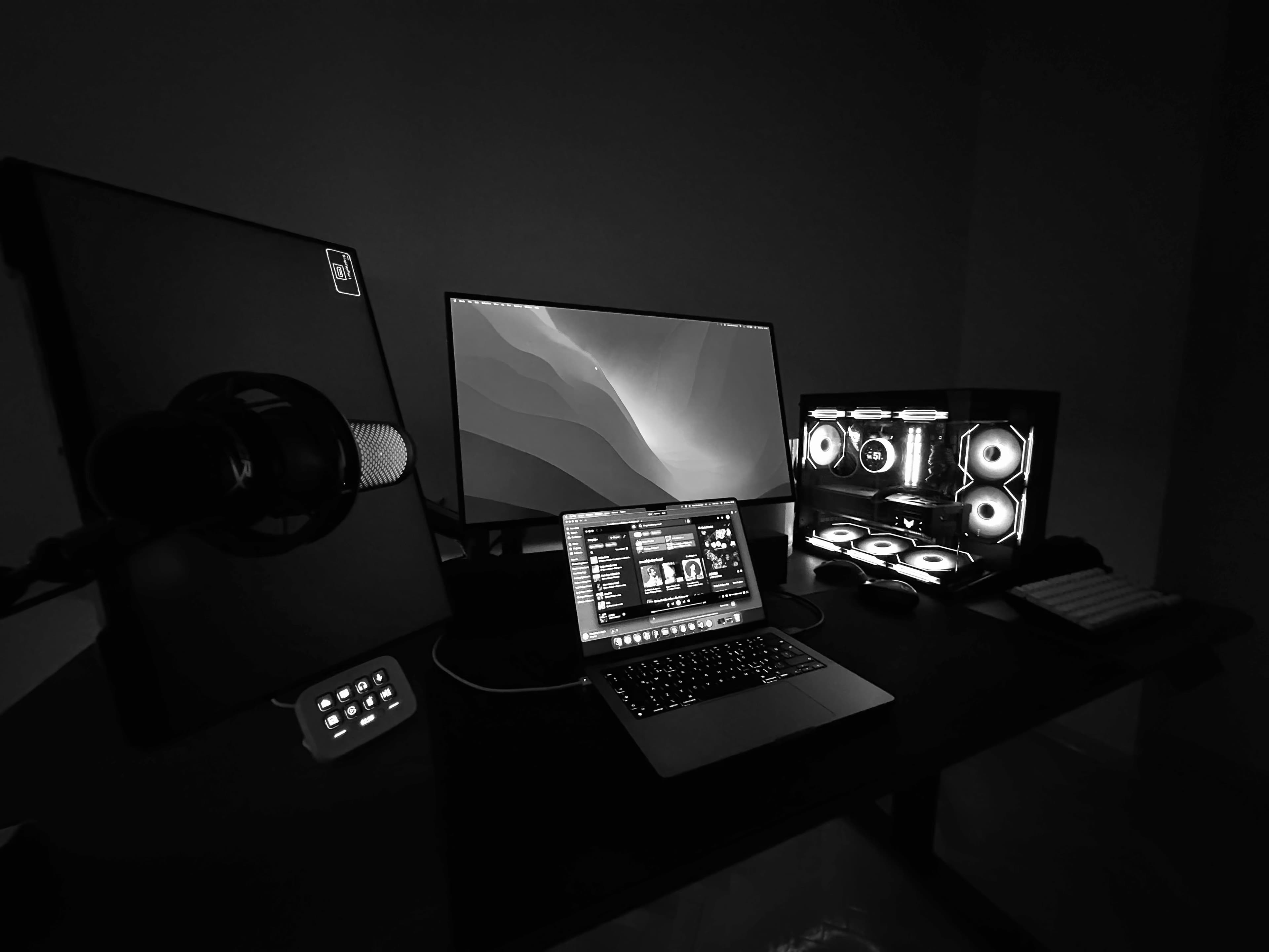 Workspace with a MacBook, external display, and desktop setup.